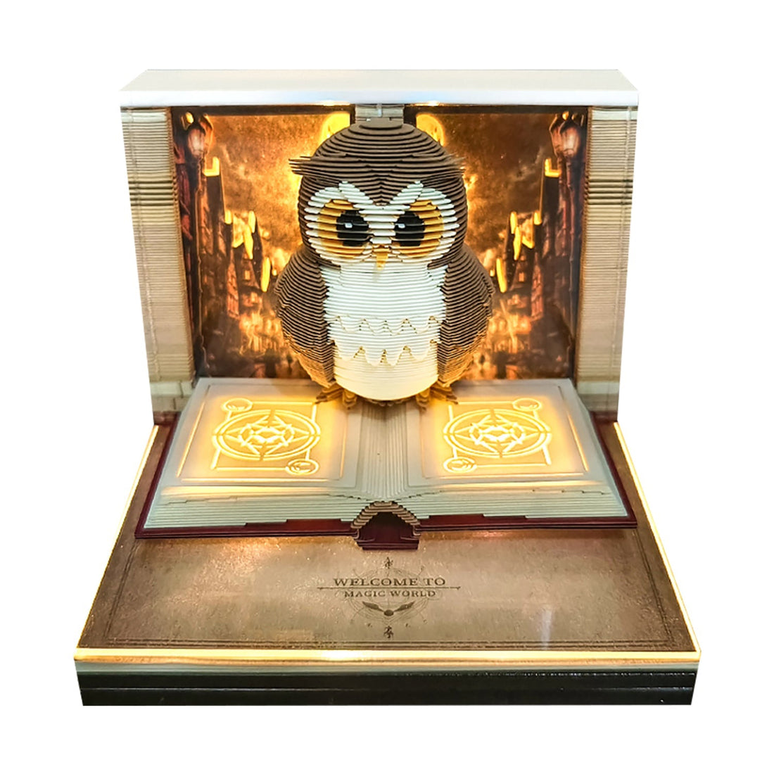 Hedwig owl on an open spell book, lit from inside