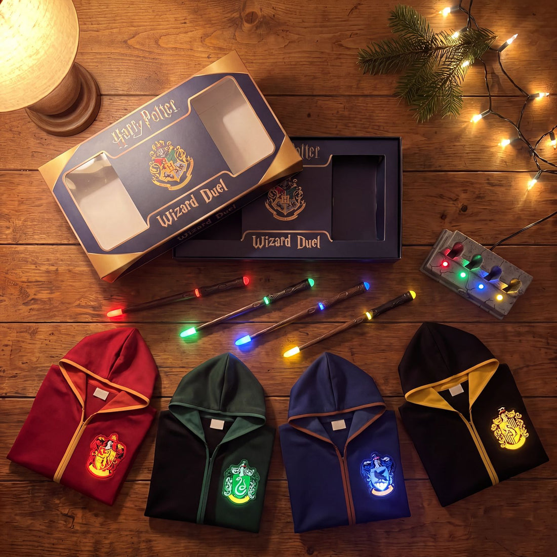 What’s in the box: 4 carved infrared wands, 4 hooded house cloaks with light-up shields and the stone-look charging base